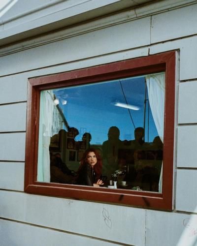 Urban Chic: Dua Lipa's Window Pose