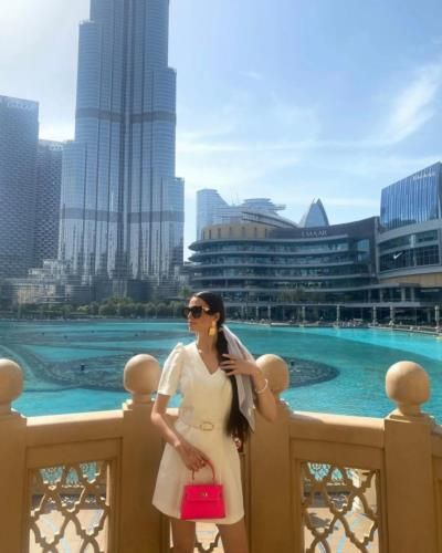 Stylish Fashionista Poses In Front Of Burj Khalifa