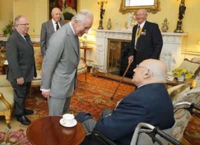King Honors Korean War Veterans At Buckingham Palace