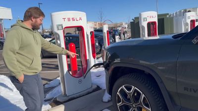 Watch How Easy It Is To Charge A Rivian R1T At A Tesla Supercharger
