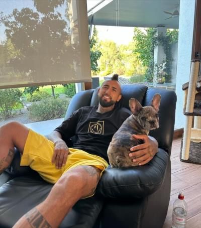 Arturo Vidal Relaxing With His Beloved Dog On The Sofa