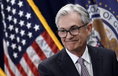 Fed holds rates steady; sees 3 rate cuts in 2024 but nods to inflation risks