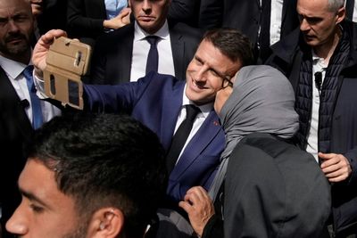 Macron Straps On Gloves For Boxing Photoshoot