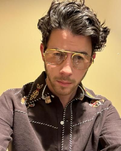 Nick Jonas Radiates Charm And Style In Latest Photoshoot