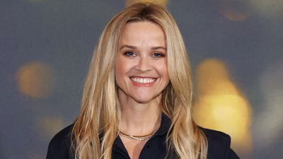 Reese Witherspoon's living room with pristine white sofa and unpainted wood shelves is a 'vision of Quiet Luxury', homes expert says