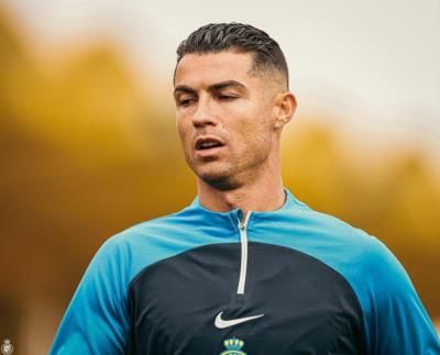 Cristiano Ronaldo Radiates Charisma In Teal And Black Shirt