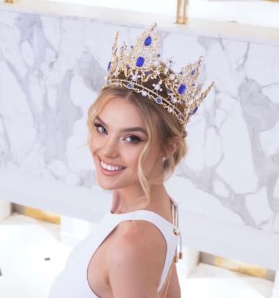 Krystyna Pyszková Stuns In White With Golden And Blue Crown