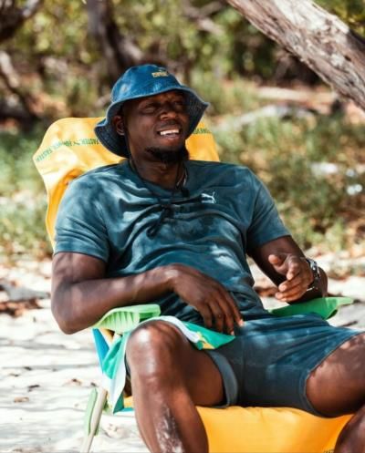 Usain Bolt's Beachside Bliss: Embracing Relaxation And Contentment