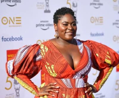 Danielle Brooks Radiates Confidence In Vibrant Orange Ensemble