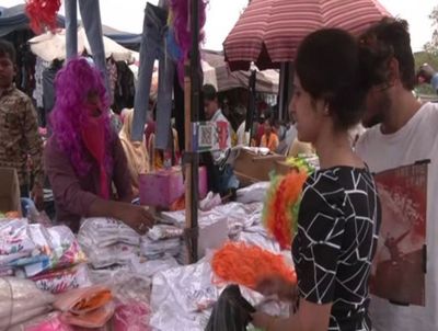 Shoppers throng Delhi markets ahead of Holi, tourists exude celebratory vibes
