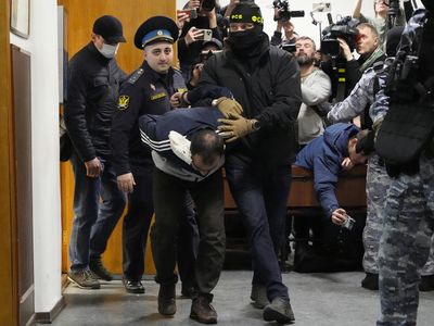 4 men charged in Moscow attack as Russia marks a national day of mourning