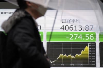Asian Shares Mixed As Investors Await Fed Interest Rate Decision