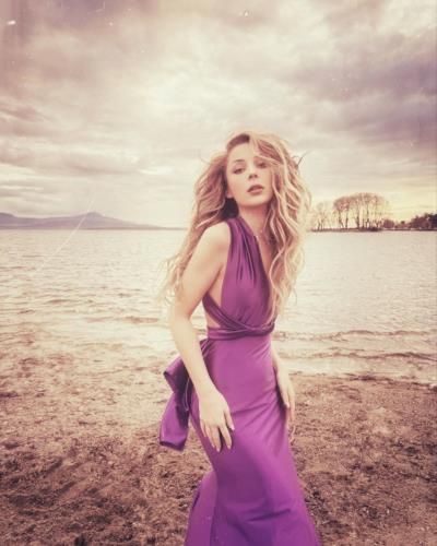 Elona Ndrecaj Radiates Elegance In Stunning Purple Ensemble