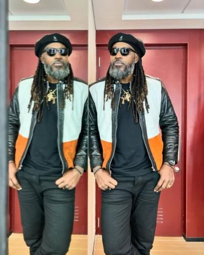 Chris Gayle's Stylish Black Outfit With Vibrant Jacket