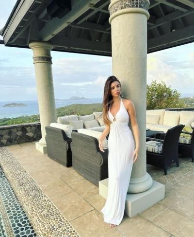 Elegant White Ensemble: Andela Vukadinovic's Graceful Pose