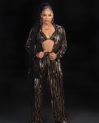 Bianca Belair Stuns In Bold Black And Brown Outfit