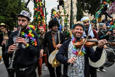 Smiling Through Tears: Hostage Families Lead Jerusalem Purim Parade