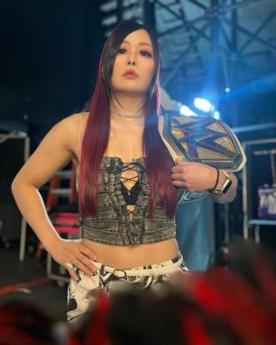 Iyo Sky Triumphs With WWE Belt In Ring Victory Celebration