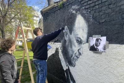 Portraits Of Navalny Painted On Property Near Soviet Monument