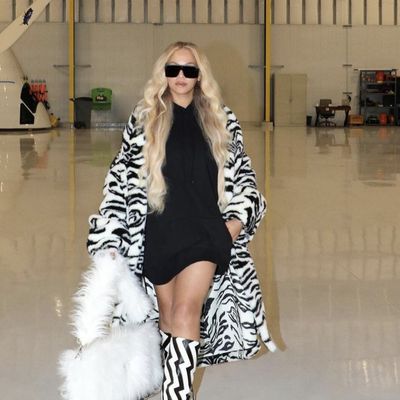 Beyoncé Spends 'Cowboy Carter' Eve in a Zebra Print Coat and Clashing Boots