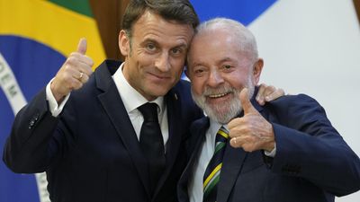 Macron joins online jokes about cuddly 'wedding' pics with Lula