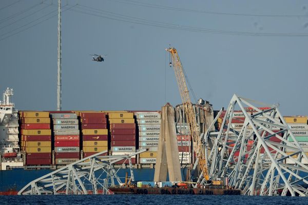 Crane moves in as officials to start cleaning up Baltimore bridge wreckage