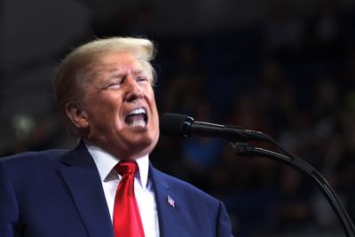 Trump Draws Criticism After Sharing Video with Image of Biden Tied in the Back of a Truck