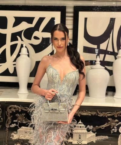 Captivating Elegance: Kristiyana Yordanova's Stylish Silver Dress Collection
