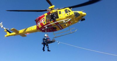 Man knocked over by wave on rock platform airlifted to hospital