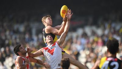 Tigers upset Swans to give Yze first win as coach