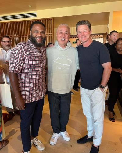 Celebrity Anthony Anderson Poses With Friends At Food Event