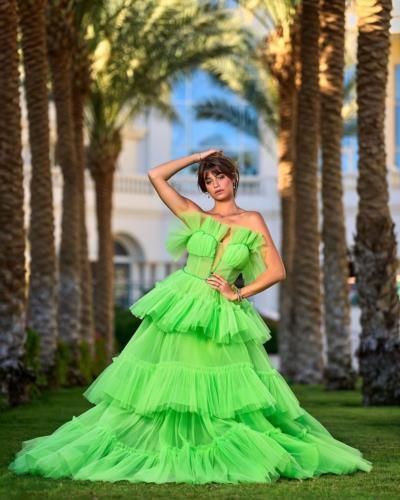 Elegant Charm: Estefany Rivero In Vibrant Parrot Green Dress