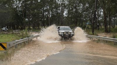 Chaos as Sydney drenched with month of rain in 16 hours