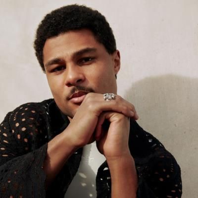 Serge Gnabry Stuns In Stylish Black Outfit For Photoshoot
