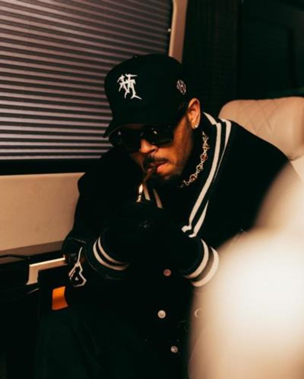 Chris Brown's Timeless Elegance In Sophisticated Black Ensemble