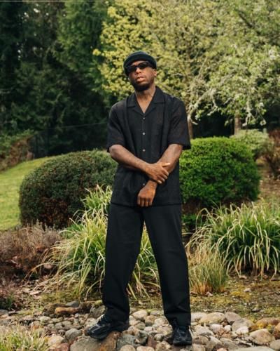 Nate Robinson's Stylish Black Ensemble Radiates Sophistication And Flair