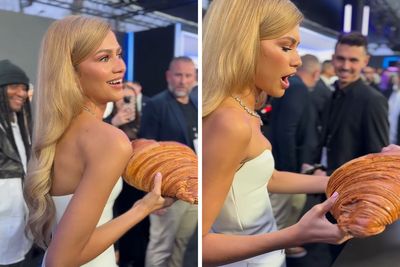 Zendaya Effortlessly Poses With The Giant Croissant She Received As A Gift At Paris Premiere