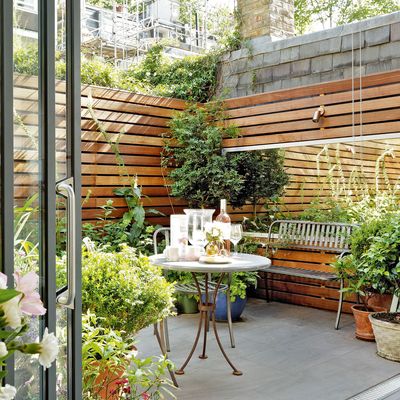 14 courtyard garden ideas that infuse a tiny space with life – the best ways to design and furnish a boxed-in patio