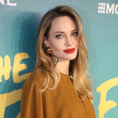Angelina Jolie Wears a Golden Goddess Dress to 'The Outsiders' Broadway Premiere