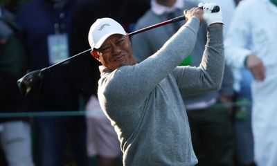 Wincing Tiger Woods endures his marathon to make Masters history
