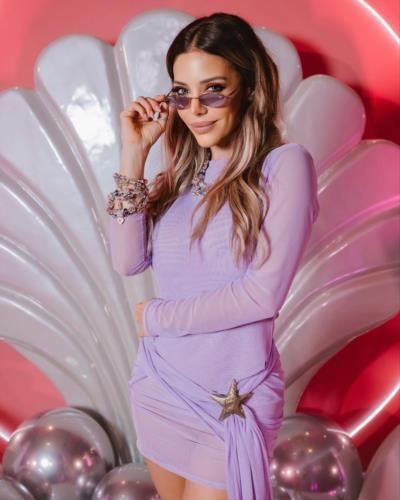 Eva Anderson Radiates Elegance In Light Purple Dress Snapshot