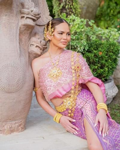Chrissy Teigen Shines In Stunning Pink Outfit