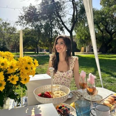 Paula Perez's Instagram Post Featuring Floral Outfit And Yellow Flowers