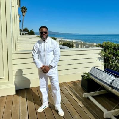 Kevin Hart's Stylish All-White Look Against Stunning Ocean Backdrop