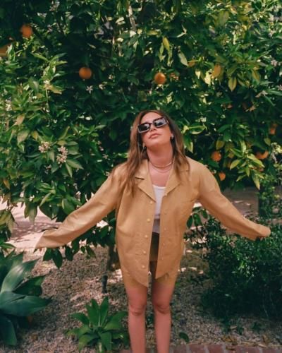 Ashley Tisdale Radiates Autumn Elegance In Stylish Brown Coat