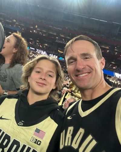 Drew Brees Captivated By Basketball Game From The Stands
