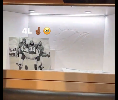 Nik Needham shows photo of two former Dolphins he keeps in his locker