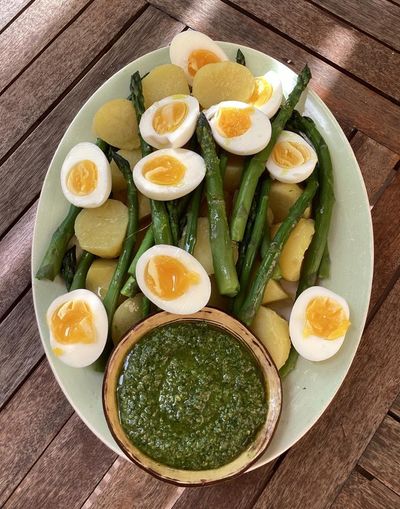 Rachel Roddy’s recipe for new potatoes, eggs, asparagus and green sauce