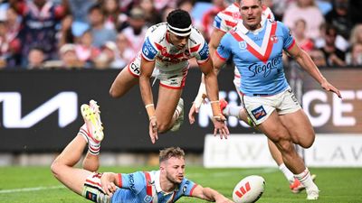 Walker leads Roosters' 60-18 thrashing of Dragons