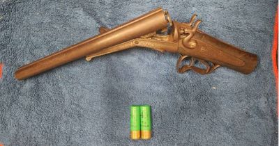 Man charged after shotgun and ammunition found in ceiling